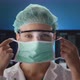 female doctor putting the protective mask on - VideoHive Item for Sale