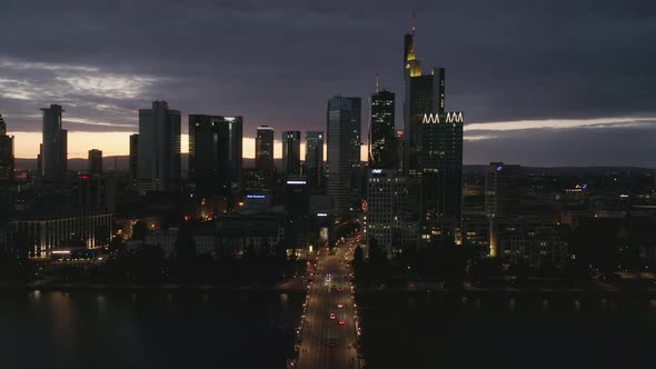 Wide Establishing Shot of Frankfurt Am Main, Germany Skyline at Night Over Main River and alt