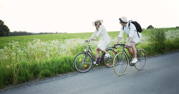 Couple Riding Bicycles in Countryside