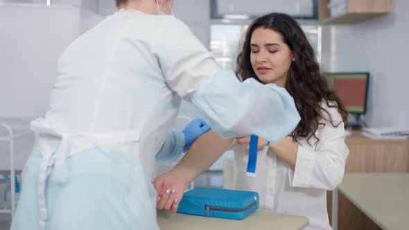 Female Patient Speaking with Nurse before Drawing Blood alt