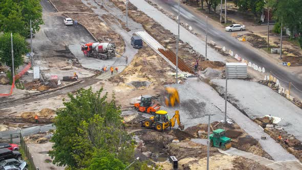 Concrete Works for Road Construction with Many Workers and Mixer Timelapse alt
