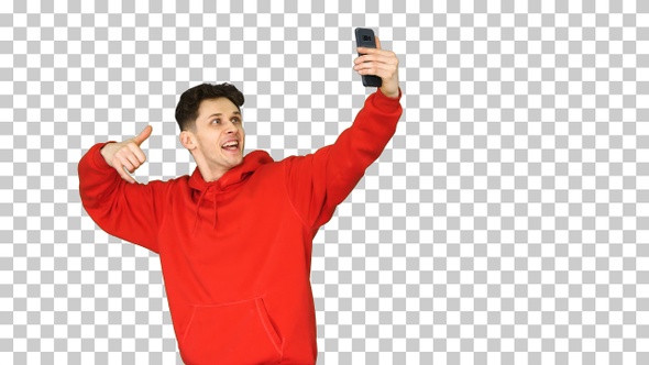 Excited Casual Man Dancing and Making Selfie with His Phone alt