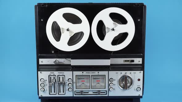 Reproduction Of An Old Bobbin Tape Recorder On A Blue Background Of The Ussr Times.