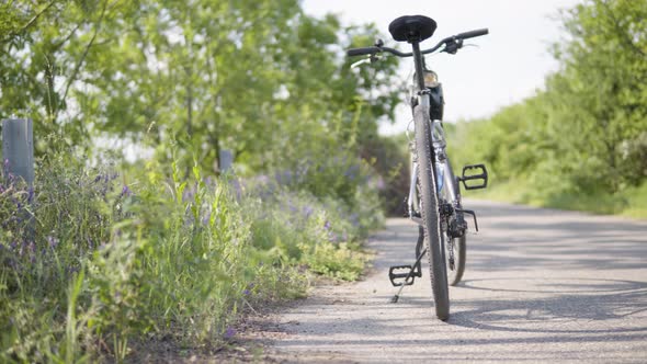 A Bike on the Side of a Road in a Rural Area  Blurry Background