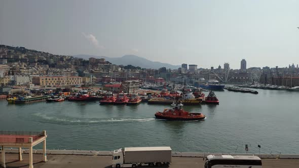 Port of La Spezia, Cinque Terre, Italy. Tugboat is moving out of its anchored to go out for a  job. alt