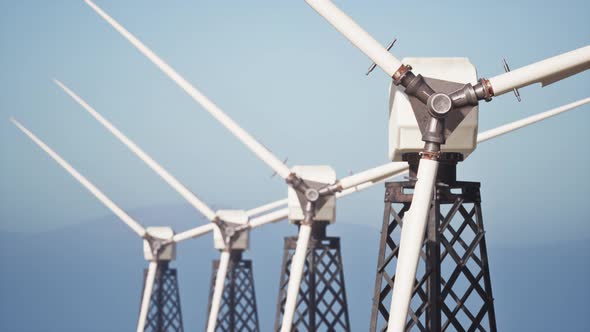 Wind Turbines In A Field Close Up alt