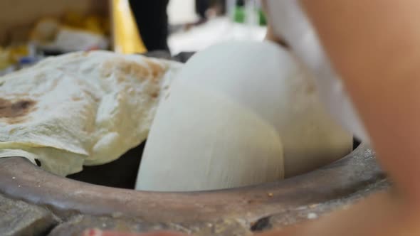 Woman National Baker Bakes Armenian Lavash in Tandoor alt