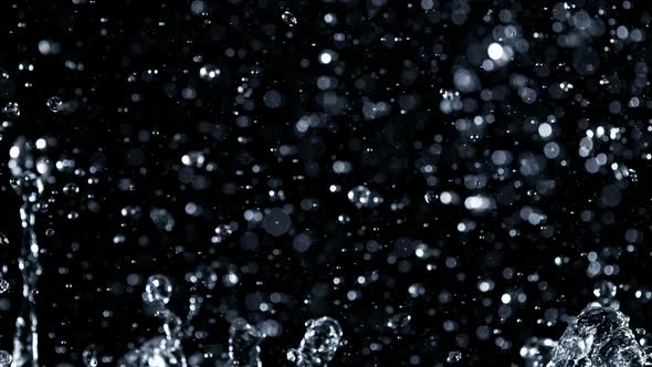 Super Slow Motion Shot of Water Splash Isolated on Black Background at 1000Fps alt