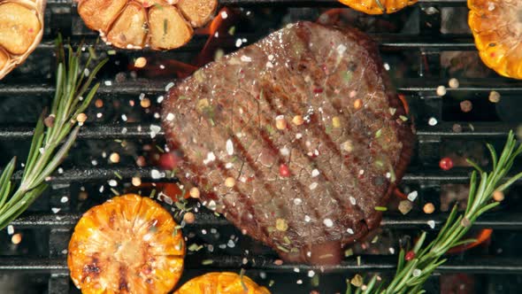 Super Slow Motion Top Shot of Seasoning Falling on Grilled Beef Meat at 1000 Fps alt