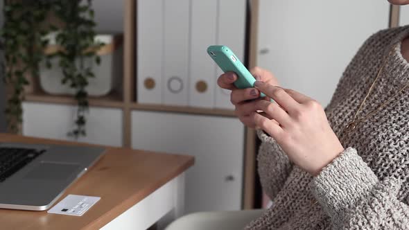Young Woman Buys Online Using her Phone
