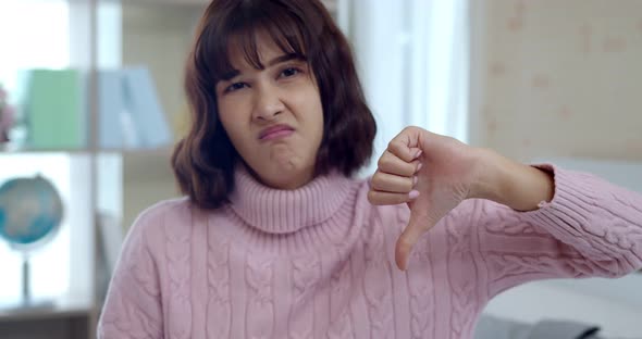 Upset young woman thump down with feels so bad alt