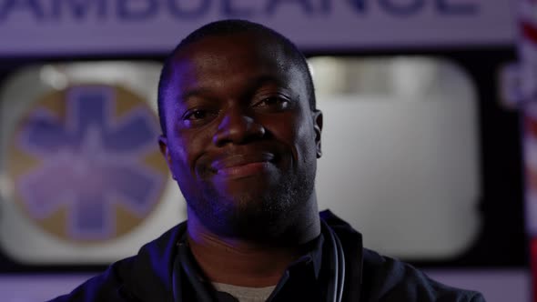 African American Paramedic Smiling on Camera Outdoors alt