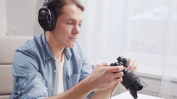 Workplace of freelance worker at home office. Young man works using computer. alt