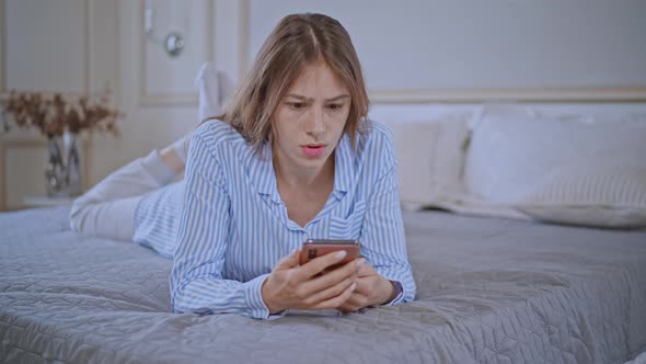 Angry and Upset Woman Chatting Using Smartphone