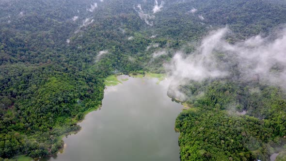 Aerial view low cloud move at Malaysia lake alt
