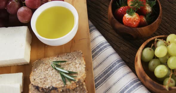 Various food items on wooden board alt