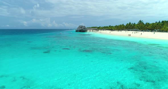 Aerial view of beautiful blue sea and sandy beach at sunny day alt