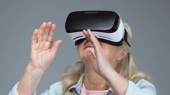 Mature Woman Wearing Virtual Reality Headset, Entertainment Device, Innovation alt