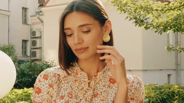 Portrait of young beautiful smiling  woman in trendy summer sundress alt