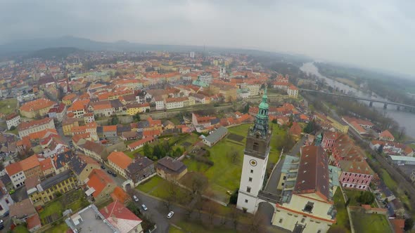 Aerial Panorama of Old City Downtown, City Hall Tower, Mountains on Horizon alt