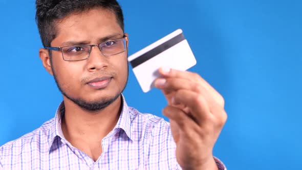  Hand Holding Credit Cards Reading Information  alt