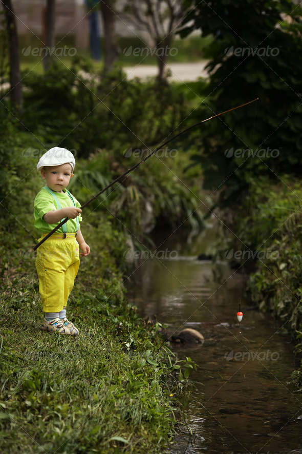 photo of little boy fishing Stock Photo by ababaka