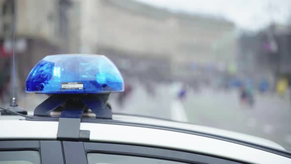 Police Flasher Flashing on the Roof of the Patrol Car alt