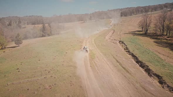 Arial cinematic shot of a 4x4 off-roading cars alt
