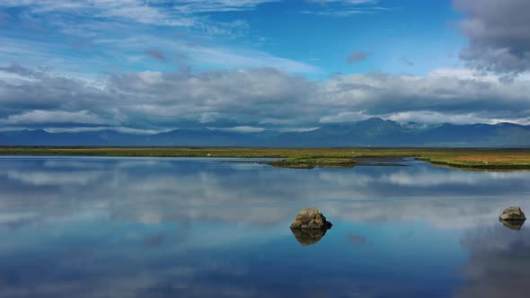 Stones with Reflection in Smooth Water alt