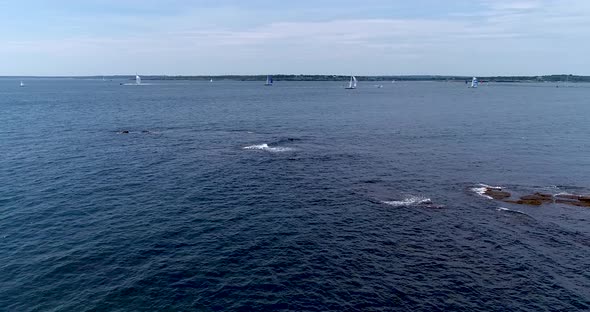 Sailboats entering and leaving Mt. Hope Bay in Newport Rhode Island as well as returning from Block alt