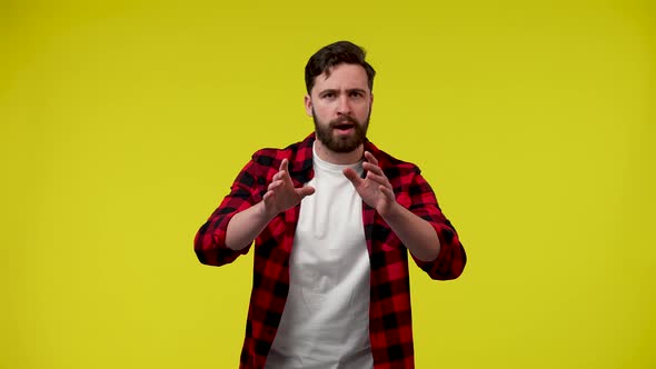 A Man Excitedly Rubs His Hands Shouts Grabs His Head with His Hands and Claps His Hands in alt