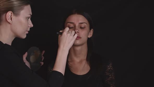Makeup Artist Applying Foundation alt
