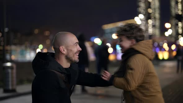 Happy Childhood and Fatherhood Moments Man and His Little Son are Playing on City Street in Evening alt