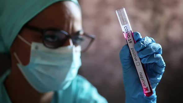 Doctor hands holding a coronavirus COVID-19 negative test tube