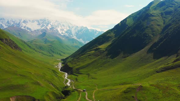 Aerial Cinematic View Of Inguri River And Mountain Pass In Ushguli alt