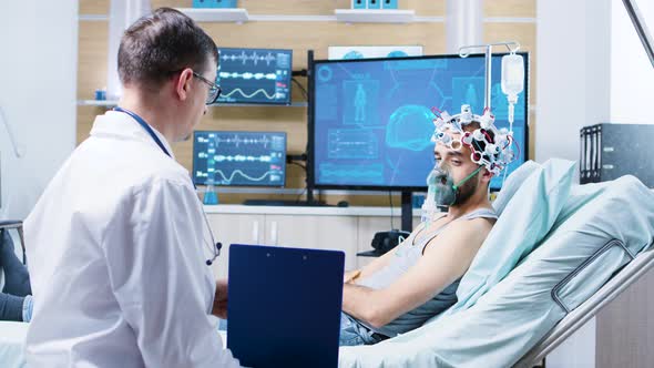 Patient in a Neurology Centre Wearing Brainwaves Scanning Headset alt