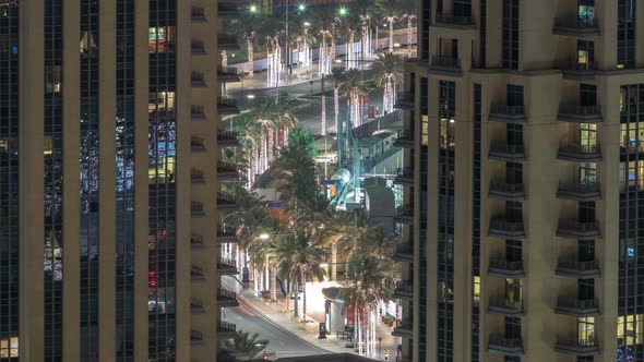 Birds Eye View of Dubai Skyline Timelapse and Rush Hour Traffic in Downtown at Night alt