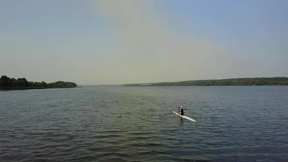 Training Athlete In Kayak. Training of small sportsmen rowers on a kayak on the river alt