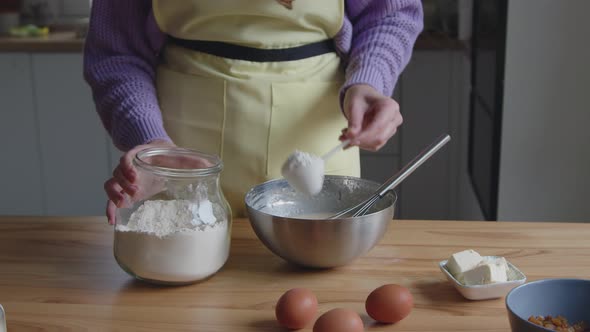 Woman Is Making Dough Adding Flour