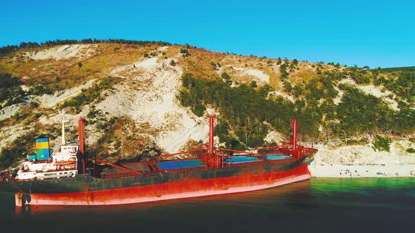 Cargo Ship Is Stranded. The Storm Washed the Vessel Ashore. Aerial View alt