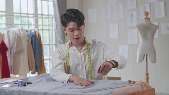 Male Fashion, Designer, Draws On A Piece Of Fabrics alt