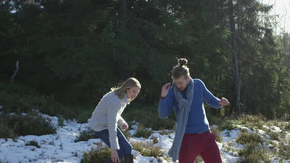 Two people playing with snow alt