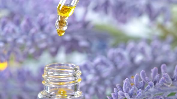 Super Slow Motion Shot of Oily Essence Drop Into Phial at 1000Fps alt