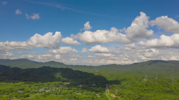 Electricity Pylon on mountains and moving clouds, alt