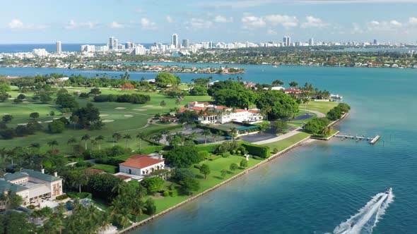  Aerial View of White Yacht Sailing in Beautiful Miami Bay with Tropic Islands alt