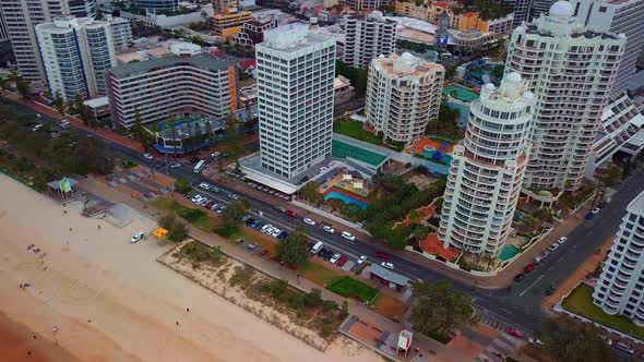 Coastal Road Traffic And Tourists On Sandy Shore At Gold Coast City In Queensland, Australia. Aerial alt