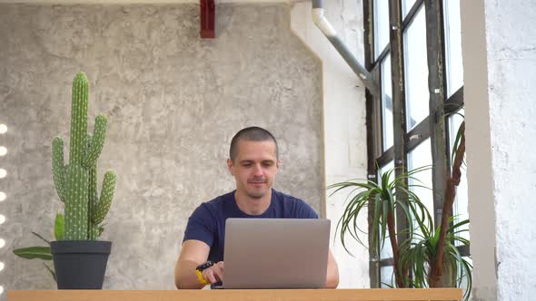 Man Working on Laptop and Then Show Thumbs Up in Camera and Smiling