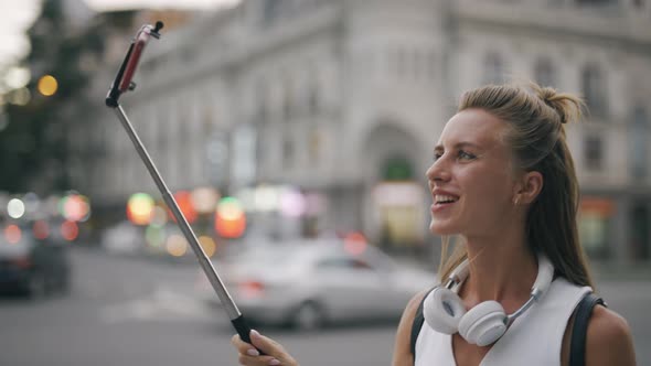 A Young Attractive Woman Blogger or Vlogger is Recording Content for Channel and Looking at alt