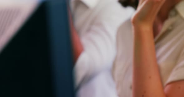 Customer service executive working in a call centre alt