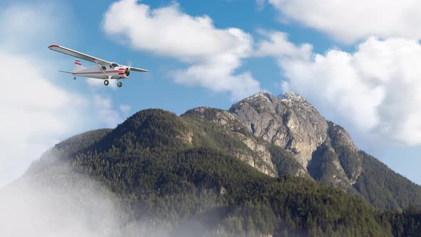 Airplane Flying Over the Mountain Landscape During Cloudy Day alt